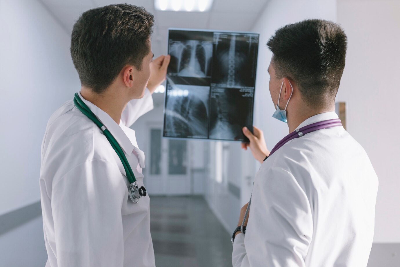two-male-doctors-looking-x-ray_23-2147763808 two-male-doctors-looking-x-ray_23-2147763808